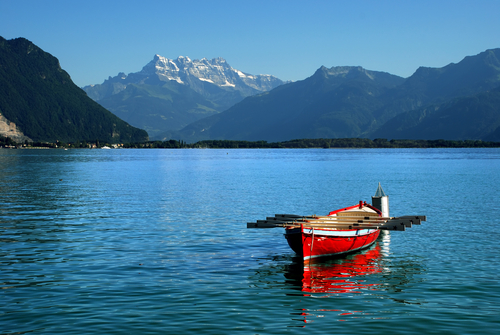 Lake Geneva switzerland from tumblr with a red boat