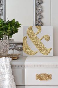 21 Awesome DIY Ampersand Art Using Golden Thumbtacks over White Canvas as a Beautiful Hall Art