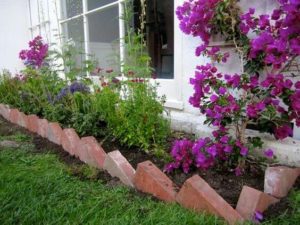 14 Simple yet Catchy Butterfly DIY Garden Edging Style with Uniquely Turned Red Brick Edge