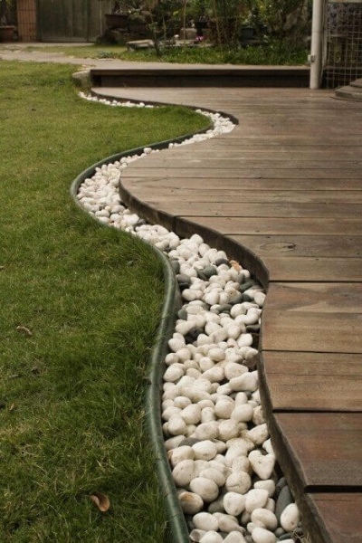 5 Urban Deck Edge Garden Dcor that is Highlighted with some Whitish River Stones