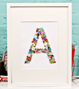 A Tutorial for Crafting Monogram Letter with Buttons on a Plain White Canvas