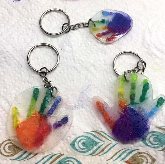 Handprint Shrinky Dink Keychains with Glittery Hand Impression