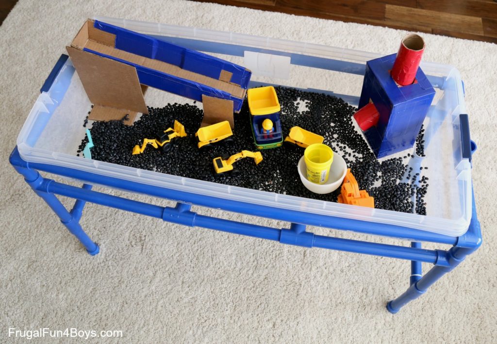 Construction Truck Sensory Bin Project with Toy Truck and DIY Tube Cardboard Ramp