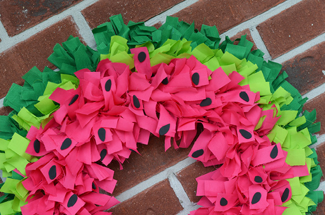 DIY Watermelon Wreath Tutorial for Summer Porch Decor with Cotton Fabric Straps Over WIre Frame