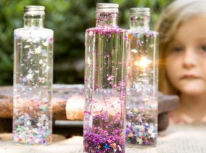 DIY Outdoor Summer Activity Idea for Toddlers: Magic Glitter Craft in Glass Bottle