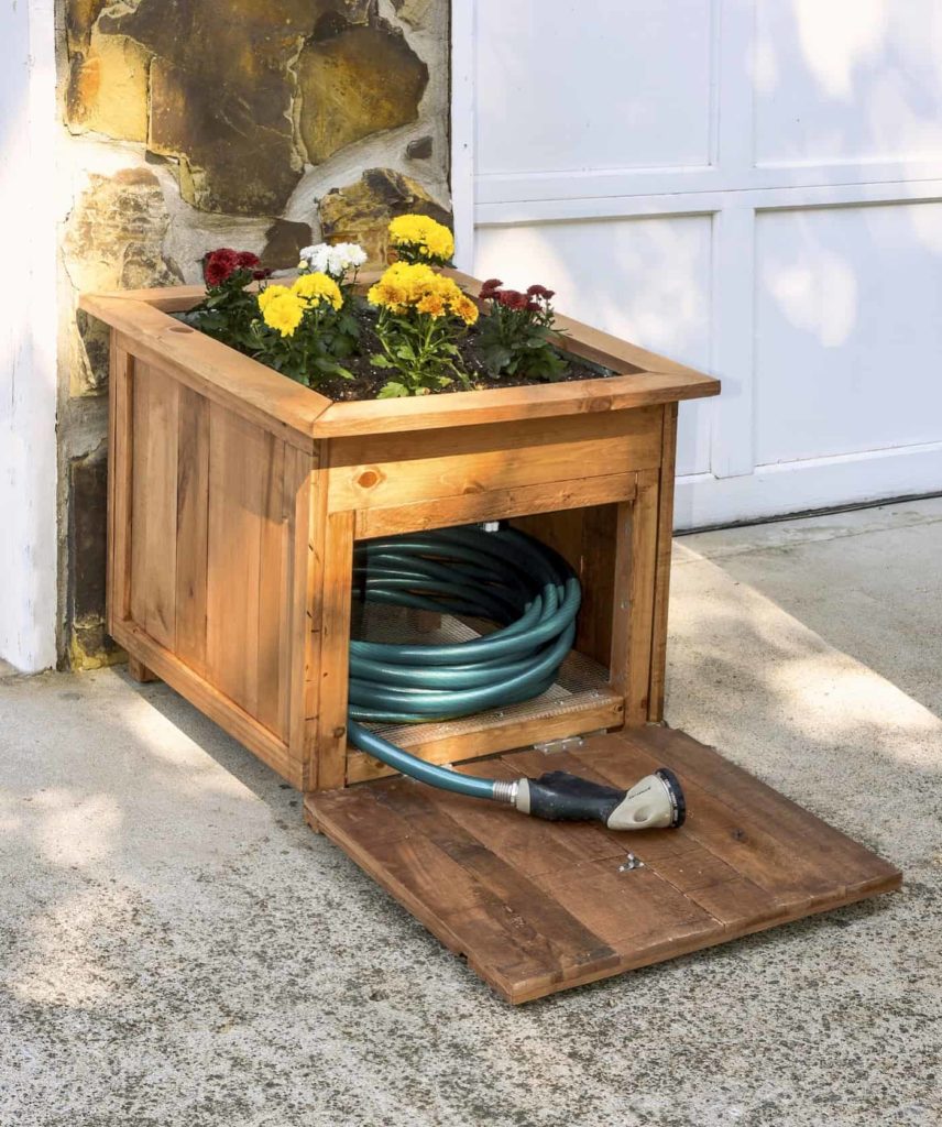 diy-pallet-wood-hose-holder-with-built-in-planter-and-hidden-storage