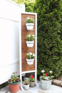 DIY Vertical Gardening: Hanging White Planters on Wooden Stand with Mid Decoration for A Pretty  ...