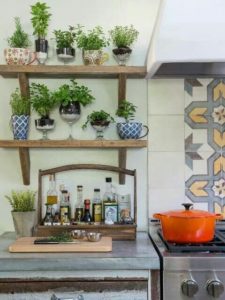 DIY Indoor Herb Gardening Idea in Large Cup Planters On Wooden Shelving Above The Kitchen Counter