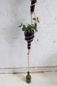 Impressive Vertical Herb Gardening with DIY Recycled Planter in Modern Design From Glass Bottles