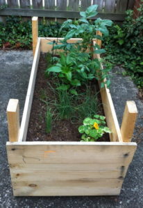 How To Build a Raised Planter Bed for Under $50 with Lumber Boards
