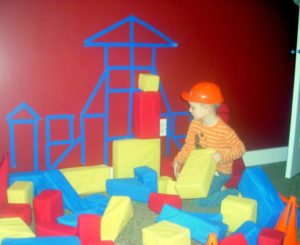 DIY Construction Theme Preschool Activity: House Sculpture with Large Foam Blocks Over Painter T ...
