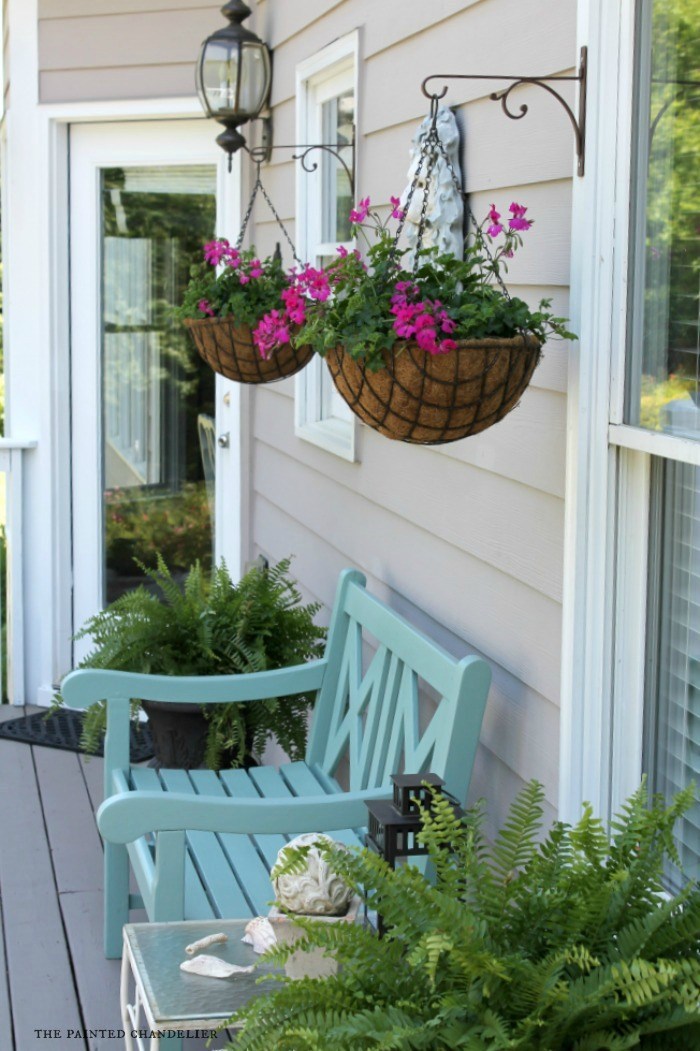 Aesthetically Embellished Porch Idea with Simple Wooden Bench and Hanging Planters