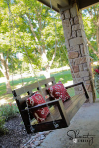 DIY Wooden Porch Swing with Cozy Cushions: A House Exterior Idea for Front Porch Area