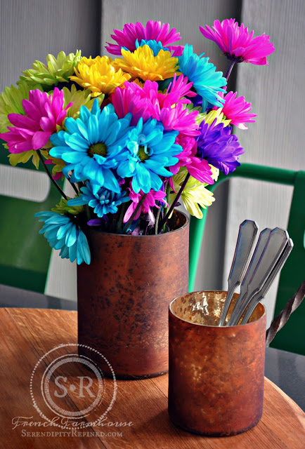 Bright and Graphic Porch Decorating Idea with Recycled Metallic Vase as Porch Tabletop