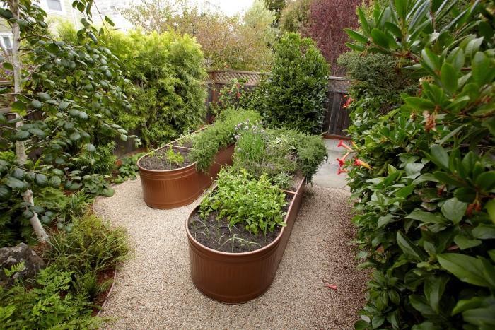 Wide Water Troughs as Raised Garden Beds with Sleek Metallic Color Accent By Gardenista