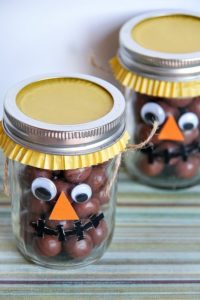 Fill the Halloween Leftover Candies in Mason Jars and Decorate to Make Scarecrow Treat Jars